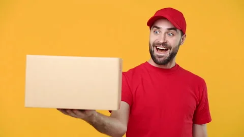 Delivery fun guy man in red cap blank t-shirt uniform workwear hold empty Stock Footage 136282310