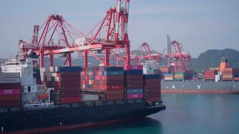 Delivery of goods by containers worldwide. Huge container ship in cargo terminal Stock Footage