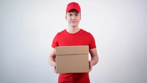 Delivery guy hands a package to a customer. Parcel delivery. Shopping online. Stock Footage 132466907