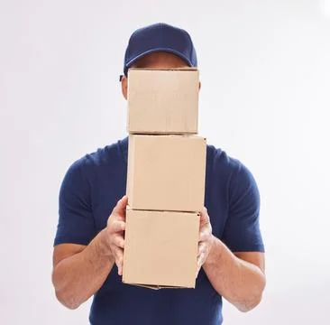 Delivery guy package, shipping boxes and export employee in studio with courier Foto stock