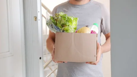 Delivery. Large cardboard box with ordered fresh vegetables and foods closeup. Stock Footage 150496630