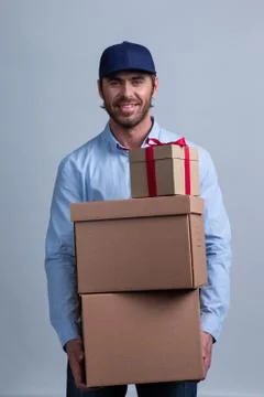 Delivery man with boxes Stock Photos