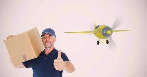 Delivery man carrying parcel while showing thumbs up against airplane Stock Photos