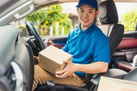 Delivery man courier in uniform hold documents clipboard checking list parcel Stock Photos