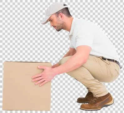 Delivery man crouching while picking cardboard box Stock Photos