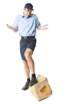 Delivery man with damaged package Stock Photos