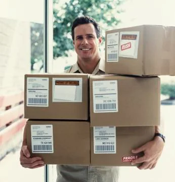 Delivery man delivering boxes 写真素材