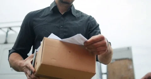 Delivery man delivering package to customer, close up at and and box Stock Footage 77208490