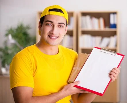 Delivery man delivering parcel box 写真素材