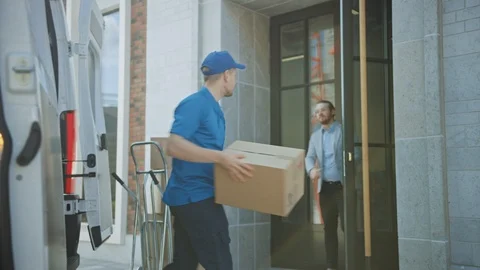 Delivery Man Gives Postal Package to Customer, Who Signs Electronic Signature Stock Footage 116090382