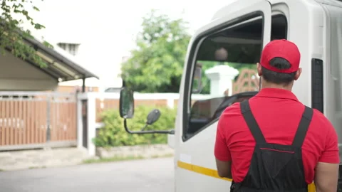 Delivery man move items to the house. Stock Footage 245283702