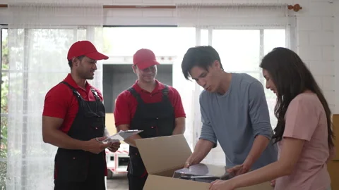 Delivery man move items to the house. Stock Footage 245283721