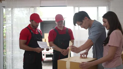 Delivery man move items to the house. Stock Footage 245283778
