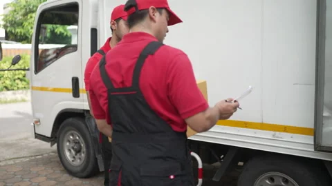 Delivery man move items to the house. Stock Footage 245283862