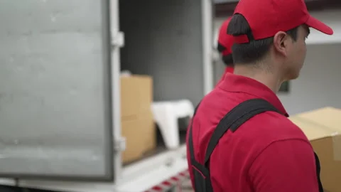 Delivery man move items to the house. Stock Footage 245283935