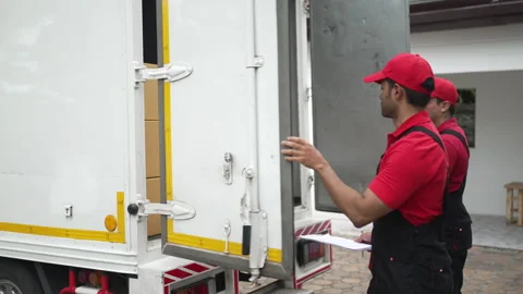 Delivery man move items to the house. Stock Footage 245283967