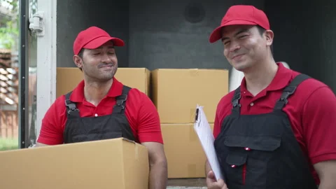 Delivery man move items to the house. Stock Footage 245283983