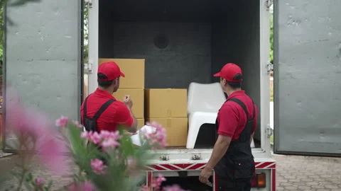 Delivery man move items to the house. Stock Footage 245284176