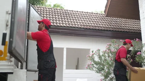 Delivery man move items to the house. 스톡 동영상 245284442