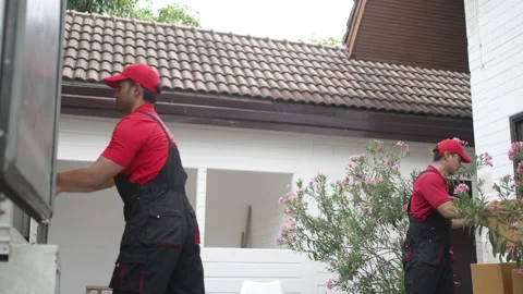 Delivery man move items to the house. 스톡 동영상 245284525