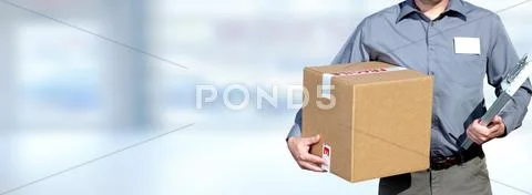 Delivery man with a parcel. Stock Photos
