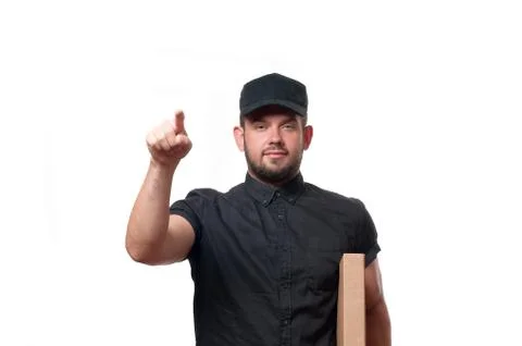 Delivery man with parcel is ringing the door bell Fotos de archivo