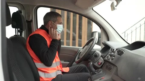 Delivery man putting on his face mask. Stock Footage 149479713