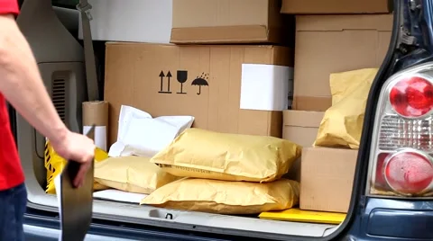 Delivery man taking package from car Stock Footage 40739315