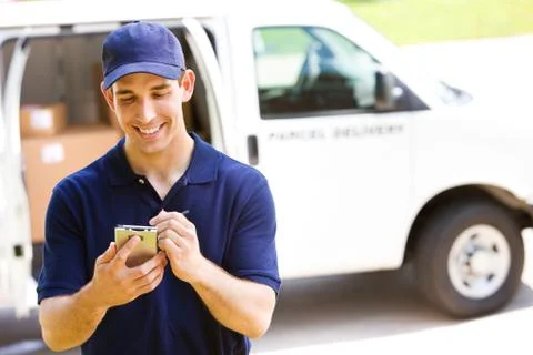Delivery: man tracking shipment with van behind Stock Photos