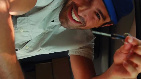 Delivery man writing on clipboard Stock Footage 301670548