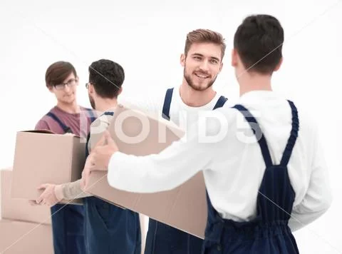 Delivery men with cardboard boxes on white background. Stock Photos