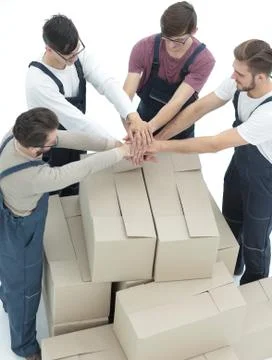 Delivery men carrying stack of boxes. Isolated on white Stock Photos