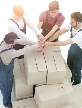 Delivery men carrying stack of boxes. Isolated on white Stock Photos