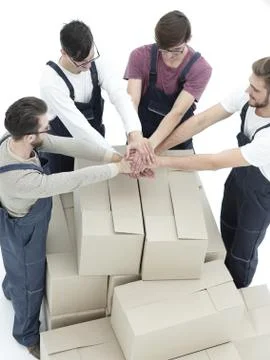 Delivery men carrying stack of boxes. Isolated on white Stock Photos