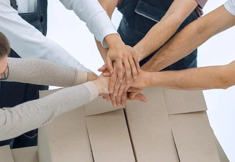 Delivery men carrying stack of boxes. Isolated on white Stock Photos