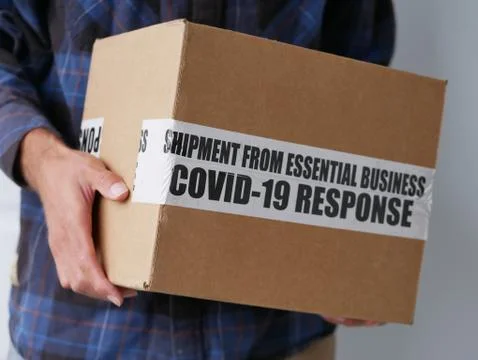 Delivery Package During Coronavirus From Essential Business COVID-19 Response Stock Photos