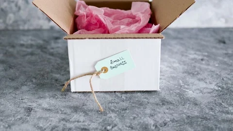 Delivery parcel from online orders with small business tag on them, customer  Stock Footage 154225707
