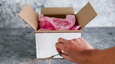 Delivery parcel from online orders with small business tag on them, customer  Stock Footage 154225727