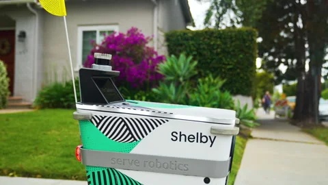 Delivery robot carefully moving backwards Stock Footage 243639766