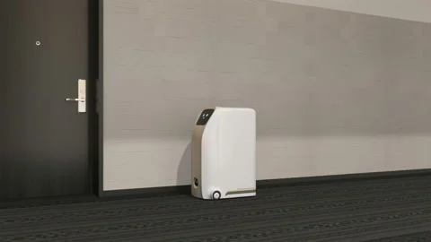 Delivery robots delivering parcel in hotel, one transport by elevator Stock Footage 131348972