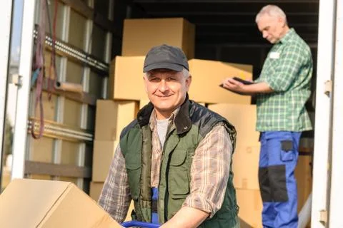 Delivery service mover man cardboard box Stock Photos