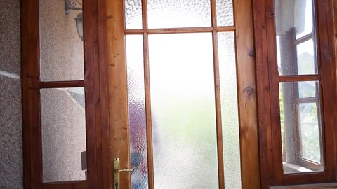 A delivery service worker  hands over cardboard boxes in the doorway of a house. Stock Footage 129549026