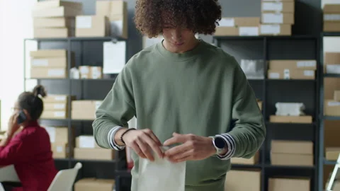 Delivery Service Worker Packing Parcel for Express Shipping 動画素材 228490709
