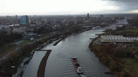 Delivery ship sailing containers into Arnhem Holland on the Rhine Stock Footage 122452795