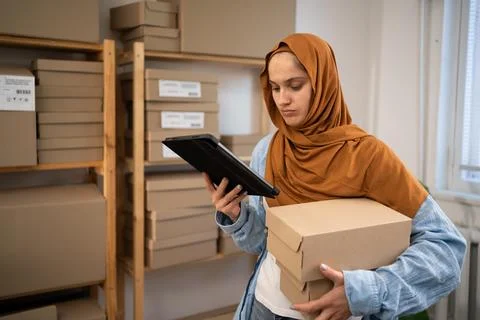 Delivery SME idea concept. Startup SME small business entrepreneur Muslim wom Stock Photos