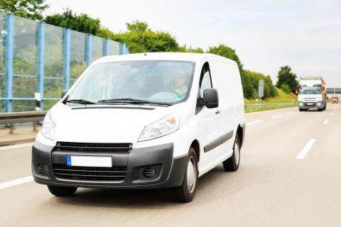 Delivery Van on Highway Stock Photos