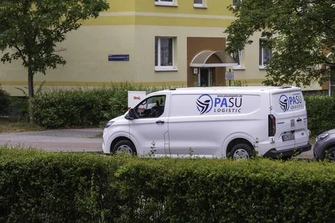 A delivery van from PASU Logistic, which also delivers shipments for Amazon Foto stock