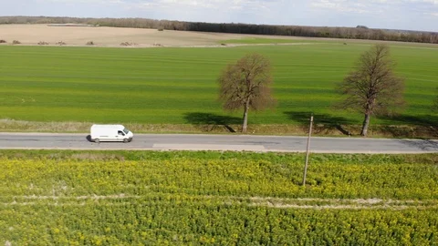 Delivery Van. Postal Delivery Service. Aerial View Shot of Car riding Through Stock-Footage 129661868