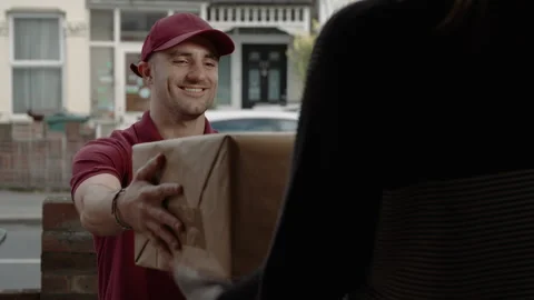 Delivery worker delivering parcel 스톡 동영상 182406398
