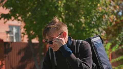 Delivery worker multitasks, Frequent shift between planning and picking orders Stock Footage 327926414